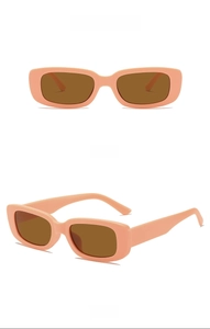 Pink frame sunglasses for kids with tea lenses in front and side view display