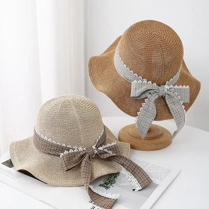Straw sun hats with plaid ribbon bows and lace trim for summer beach vacation protection