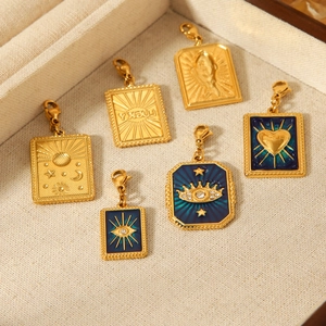 Golden tarot style charms with lobster clasps featuring sun moon and star enamel designs