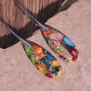 Close-up of bohemian style waterdrop earrings with colorful natural stone texture