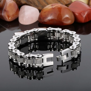 Macro shot of silver titanium steel biker chain bracelet with detailed knurling texture