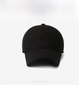 Close-up of black wool blend baseball cap with thick texture and silver diamond logo