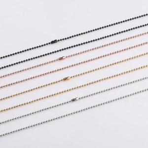 Detailed close-up of 1.5mm stainless steel bead chains in black, gold, and silver finishes