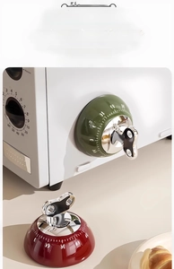 Mechanical kitchen timer showing green and red models with magnetic back and 60-minute scale