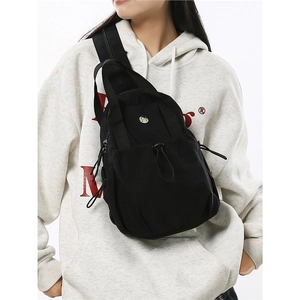 Lightweight black nylon crossbody chest bag with drawstring closure for daily commuting