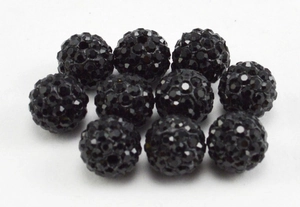 Macro shot of 8mm black clay disco ball beads with crystals for DIY jewelry making