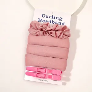 Detail view of pink heatless foam curling headband set with two matching hair clips