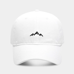Detailed close-up of mountain peak embroidery on white cotton baseball cap with twill texture