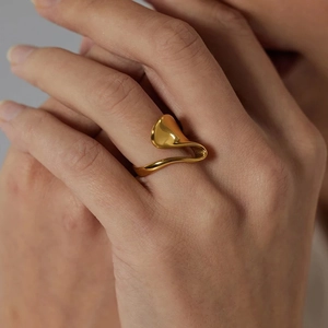 Close-up of irregular 18K gold-plated stainless steel ring with smooth organic shape