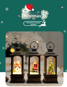 Detail of Christmas lantern set featuring Santa, Snowman, and Tree with snow effect