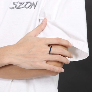 Detail of a 3mm polished blue stainless steel band ring worn by a male model