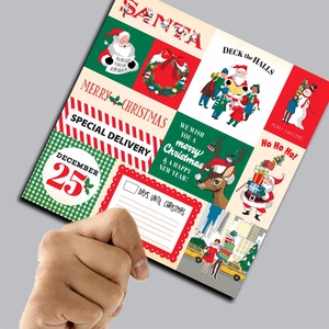 Close-up of 12 patterns of Christmas scrapbook paper with Santa and reindeer motifs