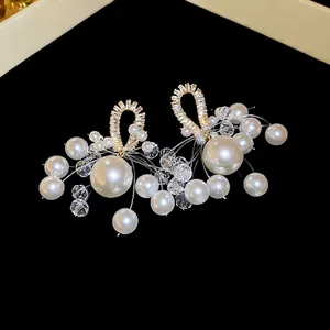 Elegant silver needle tassel earrings with zircons and pearls on luxury gold base