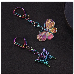 Macro view of butterfly keychains with iridescent rainbow plating and lobster clasps
