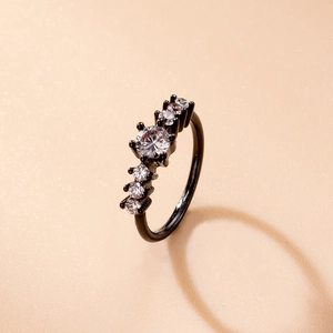 Macro shot of black plated nose ring with sparkling pavé cubic zirconia gemstones