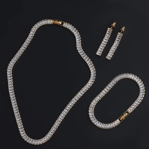 Elegant gold jewelry set with rectangular zircon necklace bracelet and earrings on black