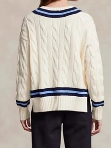 Classic cream cable knit V-neck sweater with blue stripes seen from the back view