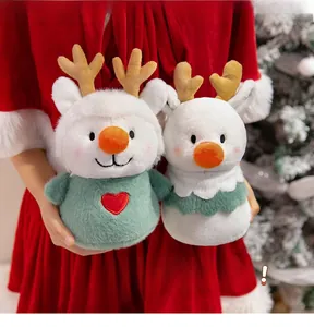 Close-up of soft plush snowman and reindeer toys held in arms for Christmas