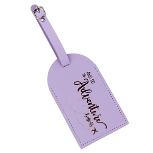 Detail of lilac PU leather luggage tag with gold lettering and adjustable strap