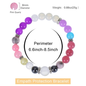 Macro shot of 8mm pink quartz beads on Empath Protection beaded bracelet