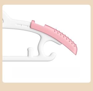 Detail of adjustable baby clothes hanger with 4-level telescopic pink non-slip shoulders