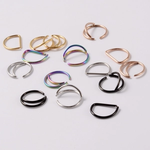 Stainless steel curved nose rings and D-shaped septums in gold, silver, black, and rainbow