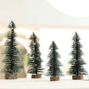 Four mini artificial Christmas trees with natural wood bases for table holiday decoration