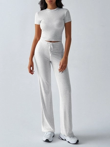 Detail view of gray short sleeve slim fit top and high waist drawstring straight pants set