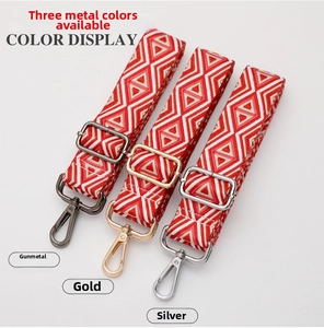 Adjustable bag strap with red diamond patterns and three metal hardware finish options