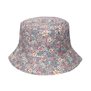 Close-up of floral fisherman hat with pink and blue flower patterns on white background
