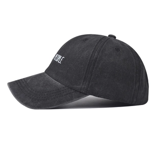 Close-up of PEOPLE embroidery on a black washed denim cotton vintage baseball cap
