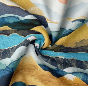 Detailed view of the soft polyester fabric texture and mountain print with golden lines