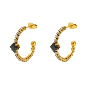 Detail of vintage gold hoop earrings with black gemstone and sparkling crystals