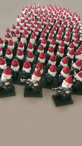 Close-up of funny garden gnome statue holding a gun with detailed red hat and green outfit