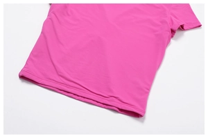 Detail of rose pink yoga T-shirt showing high-quality double-stitch hem and fabric texture