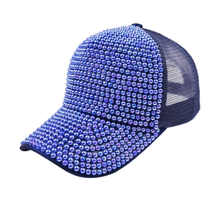 Close-up of luxury navy blue baseball cap with hand-sewn beads and mesh back