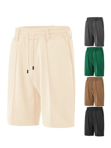 Detail of drawstring waistband and breathable mesh texture on men's casual shorts