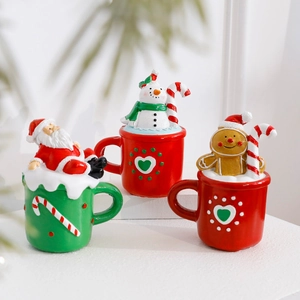 Miniature Christmas resin figurines in cup design featuring Santa, Snowman and Gingerbread Man