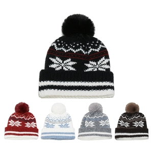 Detailed close-up showing five color variants of winter knit hats with snowflake patterns
