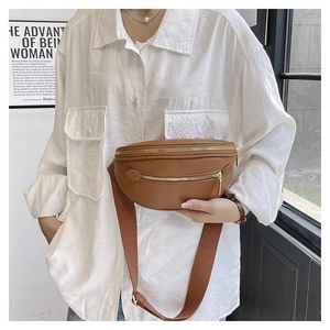 Brown litchi grain leather crossbody chest bag with adjustable wide strap and gold zippers