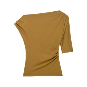 Detailed flat lay of mustard yellow one-shoulder top featuring asymmetrical ruched side seams