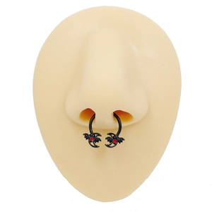 Black horseshoe septum ring featuring red gemstone bat ends on a silicone nose model