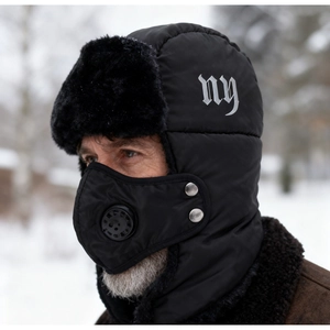 Detail of winter trapper hat with detachable face mask and warm faux fur lining