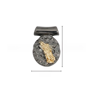 Macro shot of 13.5mm hammered black metal pendant with gold inlay detail and loop