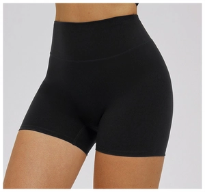 Close-up of black high-waisted yoga shorts showing high-elastic matte fabric and slim fit
