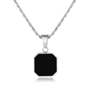Detailed close-up of a silver twist chain with an octagonal black enamel pendant on a white base