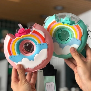 Cute doughnut shaped kids water bottle with silicone rainbow sleeve and straw strap