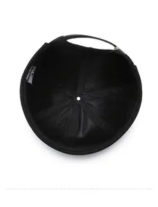 Detail view of the black docker hat interior with adjustable strap and washing label
