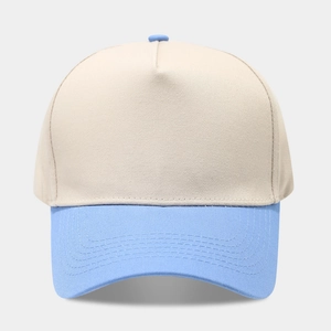 Detailed front view of a two-tone five-panel baseball cap in beige and light blue cotton