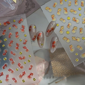 3D embossed goldfish nail art stickers with gold accents and colorful carp designs